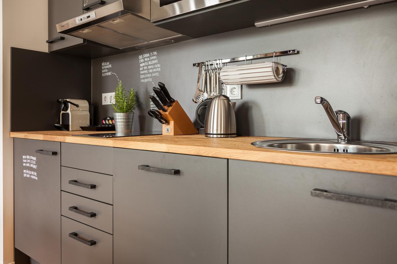 Felix Suiten Am Zwinger Dresden Exterior photo A kitchen with a wall mounted pot rack